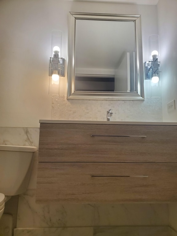 bathroom with vanity and toilet