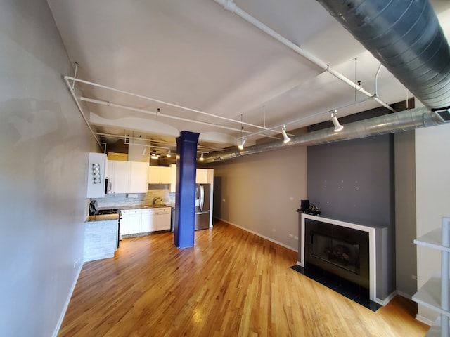 interior space featuring sink and light wood-type flooring