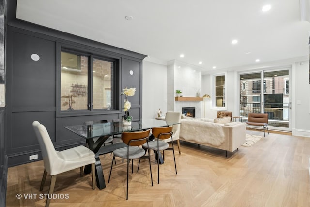 interior space featuring a tile fireplace and ornamental molding