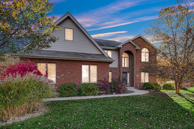 front facade with a yard