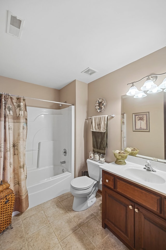 full bathroom with vanity, toilet, tile patterned floors, and shower / tub combo