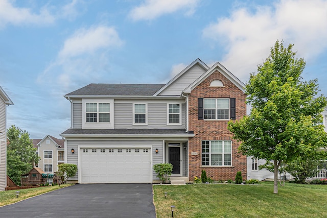 view of front of home with a garage and a front yard