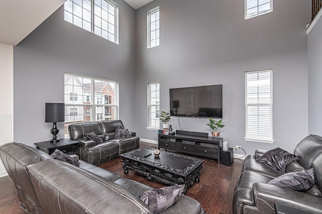12740 Timber Wood Cir, Plainfield, IL 60585 - living room featuring a towering ceiling, wood finished floors, and baseboards