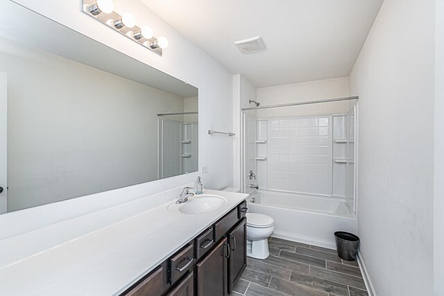 12740 Timber Wood Cir, Plainfield, IL 60585 - bathroom featuring toilet, wood finish floors, vanity, shower / bathtub combination, and baseboards