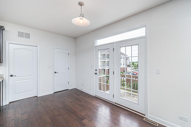 12740 Timber Wood Cir, Plainfield, IL 60585 - doorway featuring dark wood-style floors and baseboards