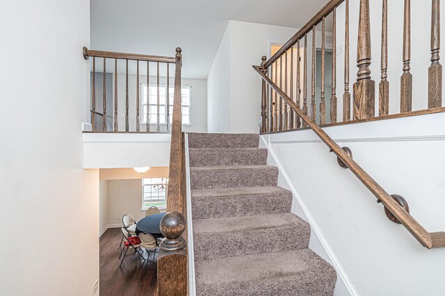 12740 Timber Wood Cir, Plainfield, IL 60585 - stairway featuring wood finished floors and baseboards