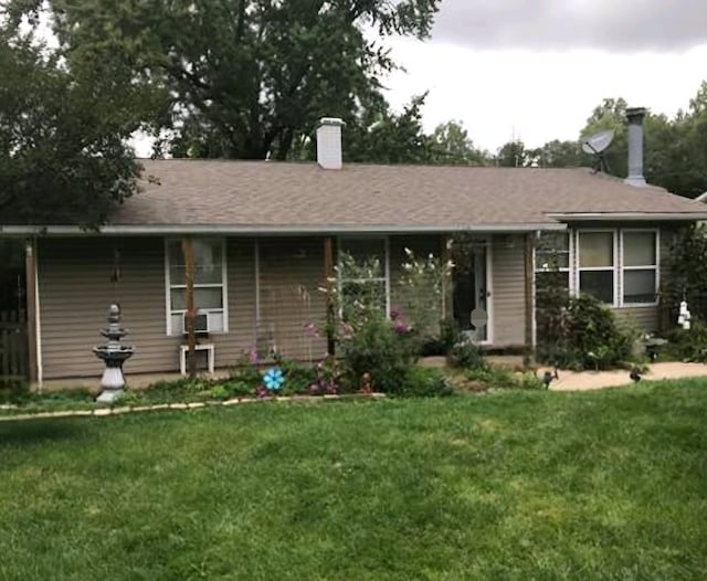 ranch-style home with a front yard