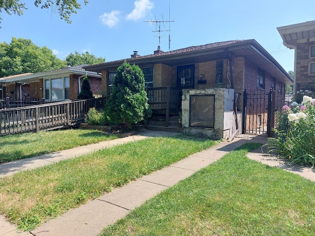 view of front of home with a front lawn