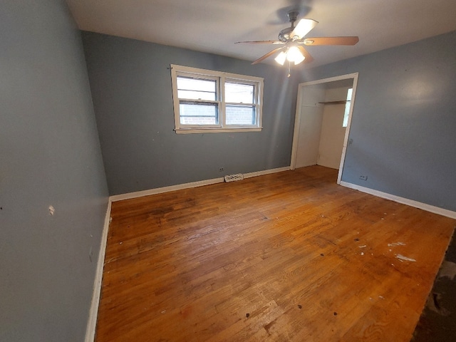 unfurnished bedroom featuring ceiling fan and hardwood / wood-style floors