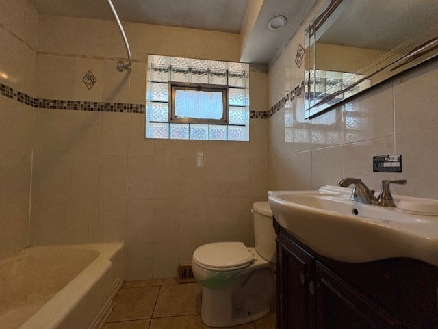 10809 S Mackinaw Ave, Chicago, IL 60617 - full bath with tile walls, vanity, tile patterned floors, toilet, and shower / bathtub combination