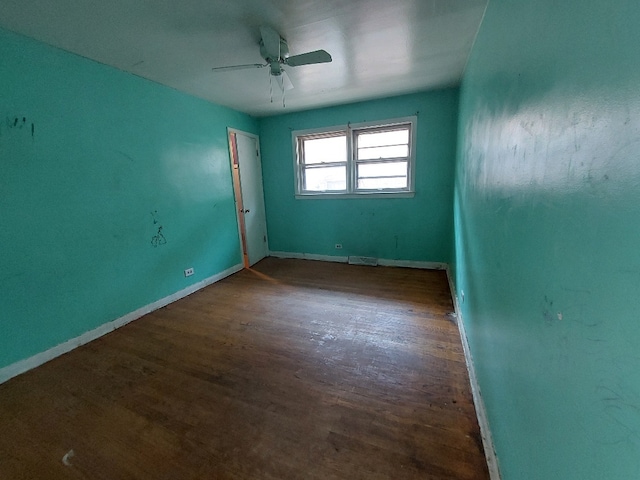 empty room featuring hardwood / wood-style floors and ceiling fan