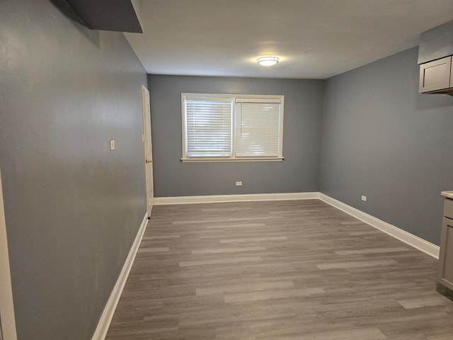 unfurnished room featuring wood-type flooring