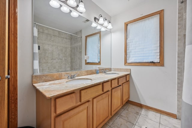 bathroom featuring vanity, a shower with curtain, and tile patterned floors