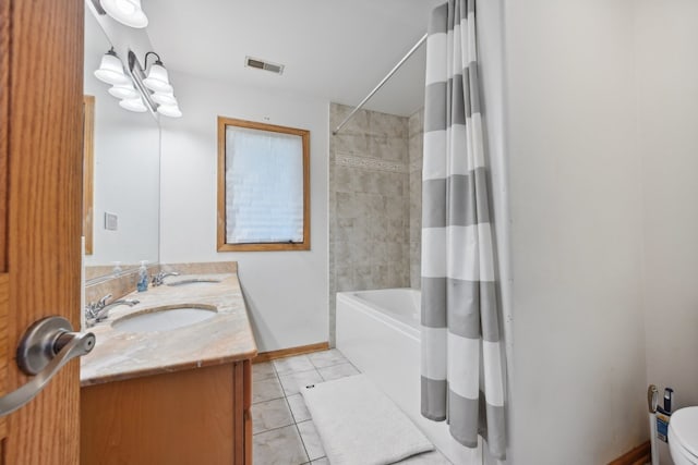 full bathroom with vanity, toilet, tile patterned floors, and shower / bath combo