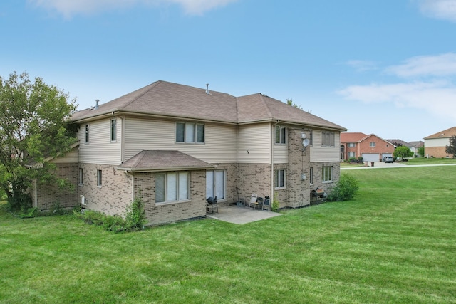 back of house with a patio area and a lawn