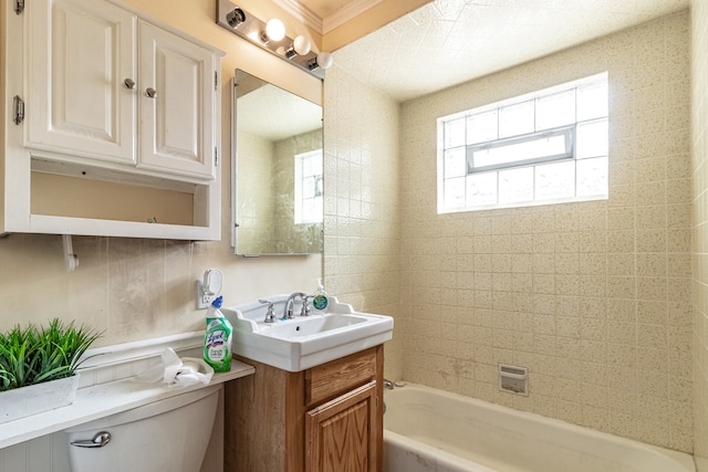 full bathroom with a wealth of natural light, vanity, toilet, and ornamental molding