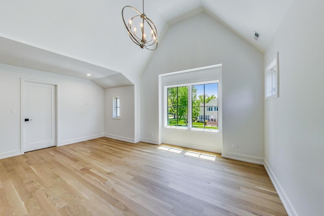 172 E Crescent Ave, Elmhurst, IL 60126 - unfurnished living room featuring a chandelier, light wood-style floors, high vaulted ceiling, and baseboards