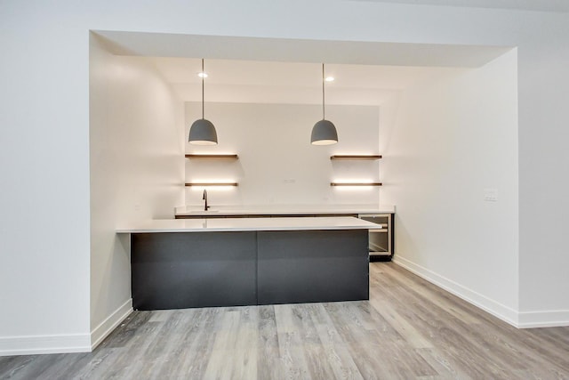 172 E Crescent Ave, Elmhurst, IL 60126 - bar area featuring baseboards, light wood finished floors, and beverage cooler