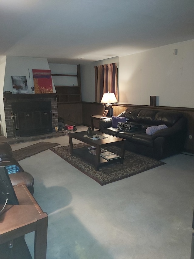 carpeted living room with a brick fireplace