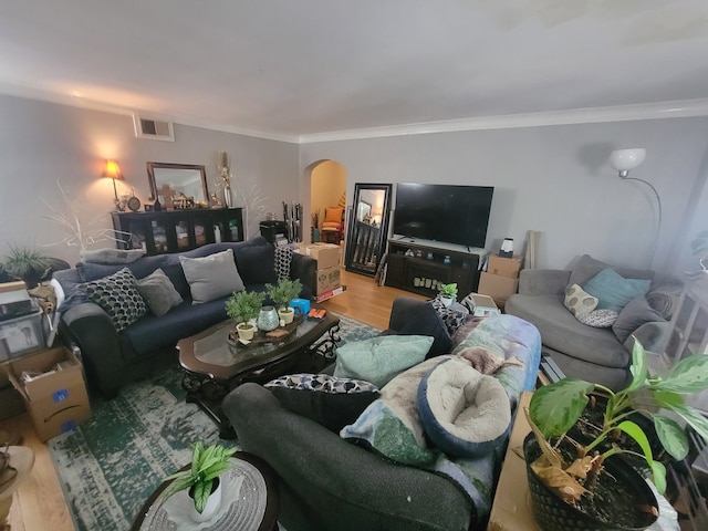 living room featuring ornamental molding and hardwood / wood-style flooring