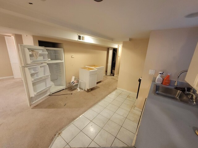 interior space featuring sink and tile patterned floors