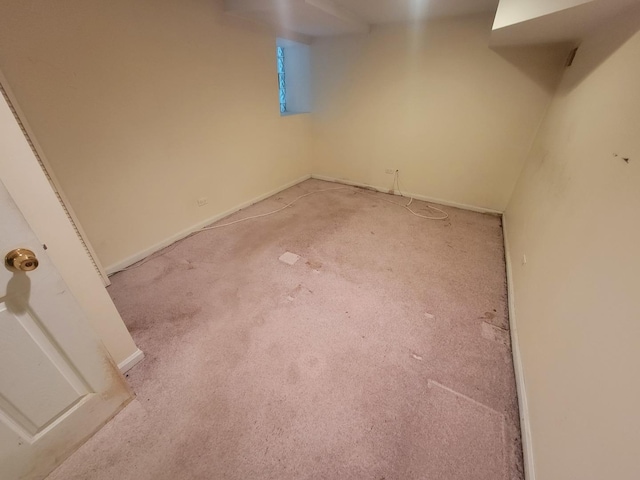 finished below grade area with light carpet and baseboards