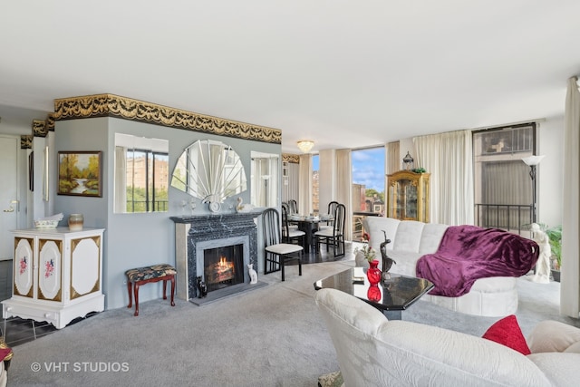 living room featuring a fireplace and carpet flooring