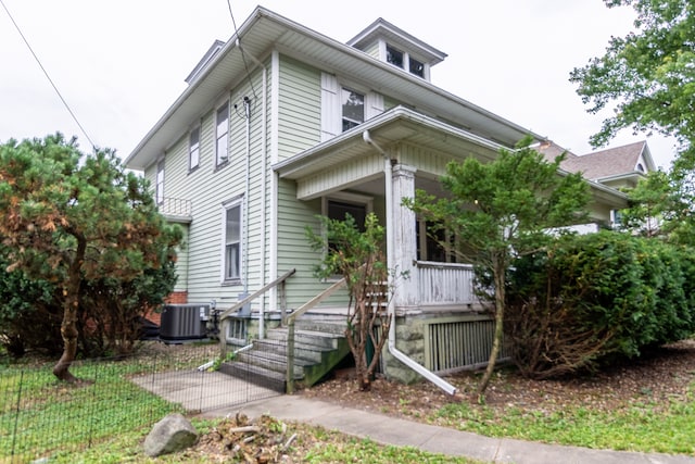 exterior space with covered porch and cooling unit