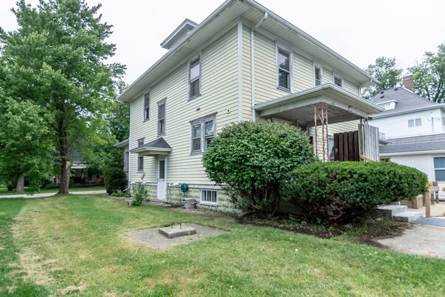 view of property exterior featuring a yard