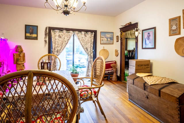 bedroom featuring light hardwood / wood-style flooring and an inviting chandelier