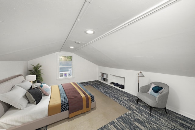 carpeted bedroom featuring vaulted ceiling