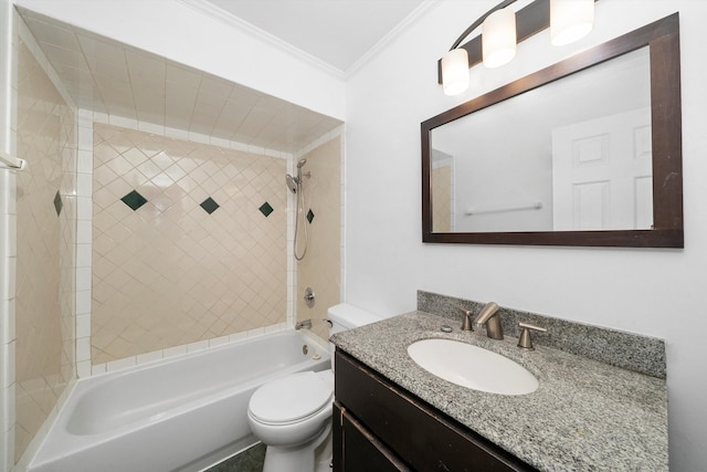 full bathroom with tiled shower / bath, toilet, ornamental molding, and vanity