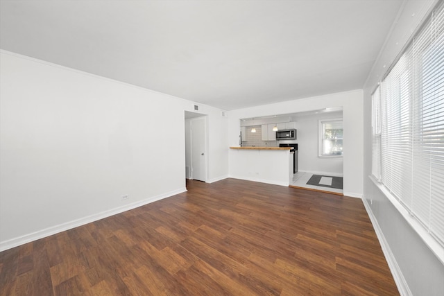 unfurnished living room featuring wood-type flooring