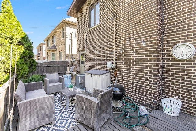 wooden deck featuring an outdoor living space