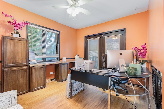 office area featuring light hardwood / wood-style floors and ceiling fan