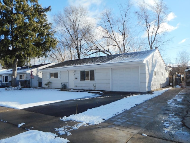 single story home featuring a garage