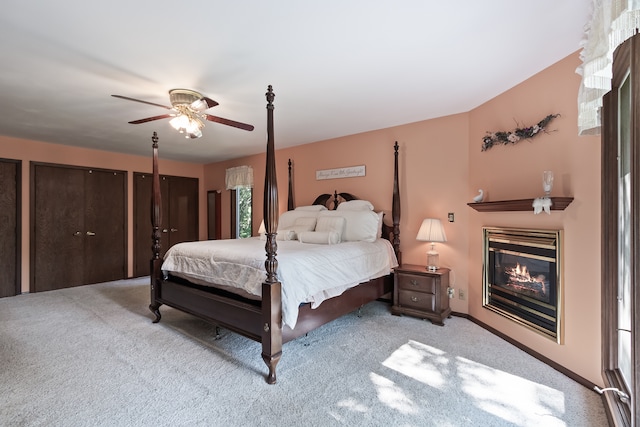 bedroom with ceiling fan and light carpet