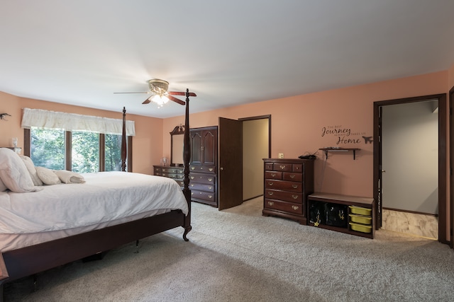 bedroom featuring ceiling fan and light colored carpet