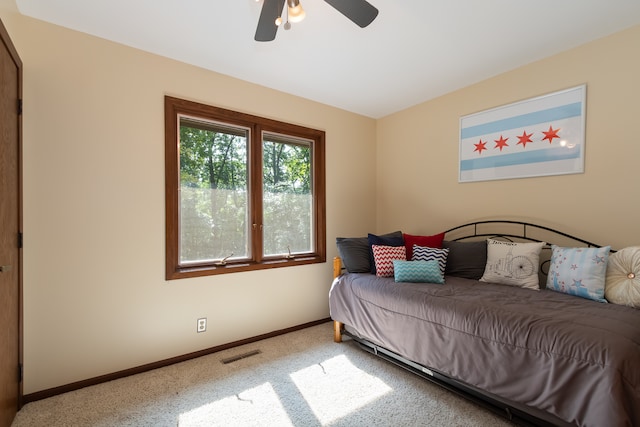 carpeted bedroom featuring ceiling fan