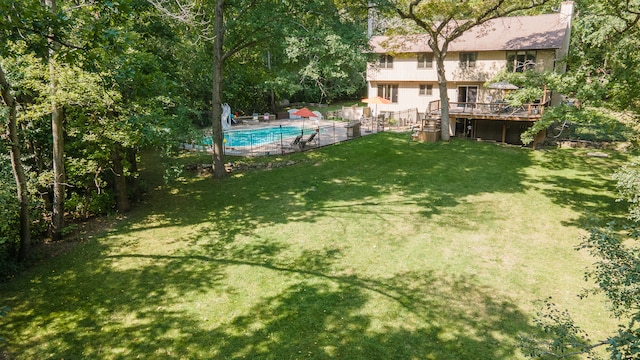 view of yard featuring a pool side deck