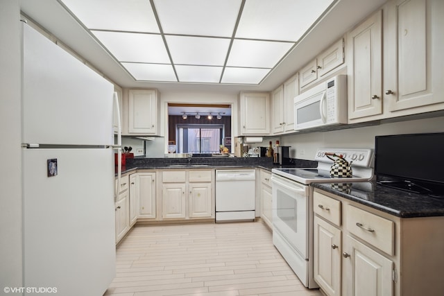 kitchen featuring sink and white appliances