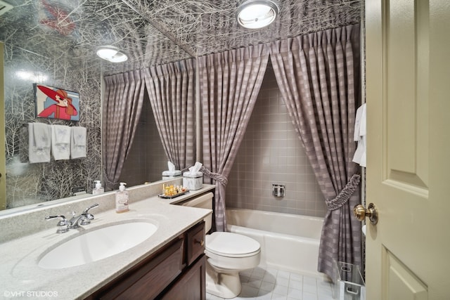 full bathroom with vanity, toilet, tile patterned floors, and shower / bath combo