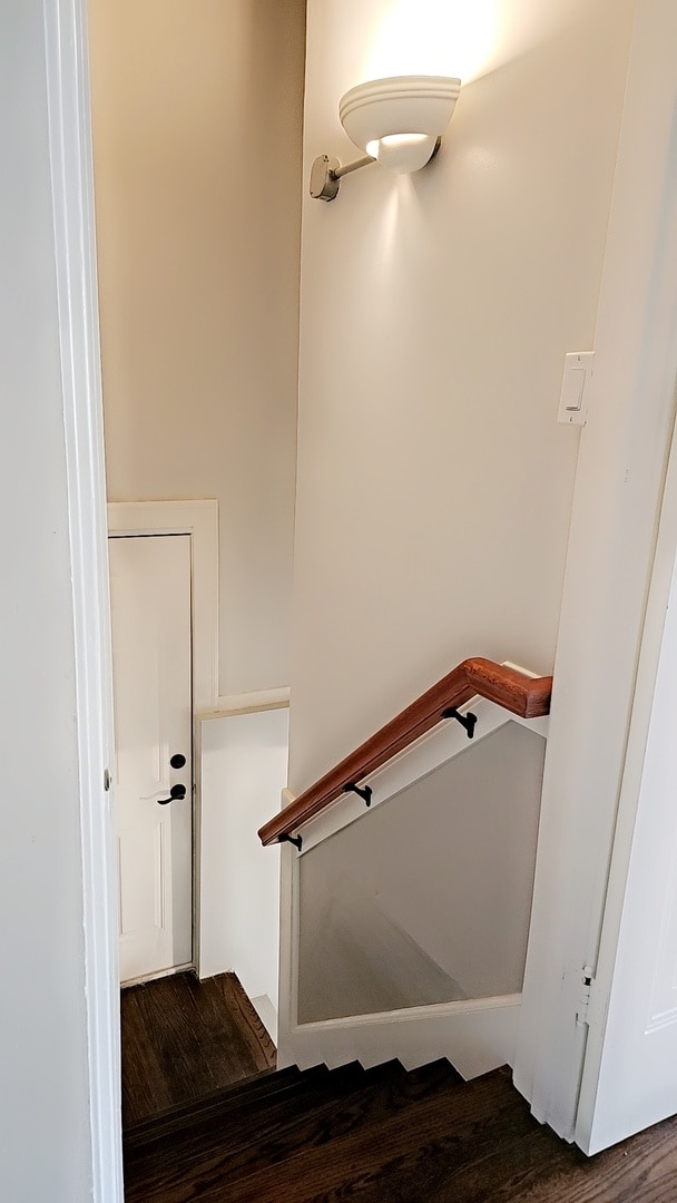 staircase with hardwood / wood-style floors