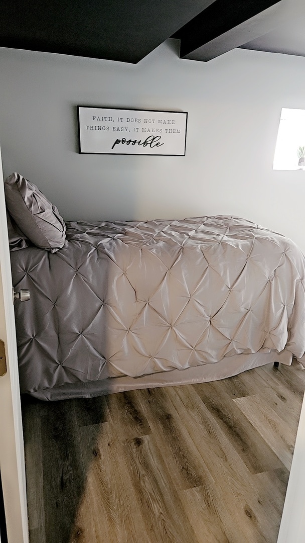 unfurnished bedroom with wood-type flooring