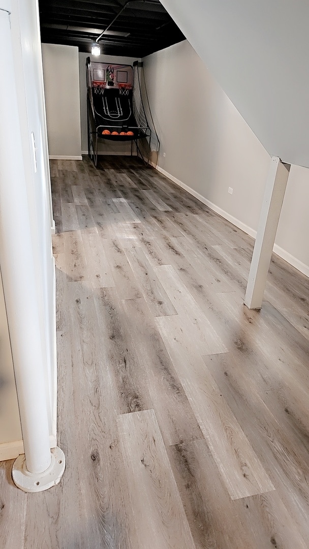 basement featuring hardwood / wood-style floors