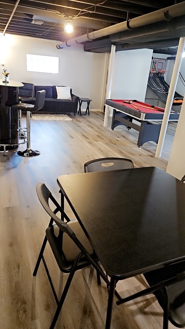 basement featuring hardwood / wood-style flooring