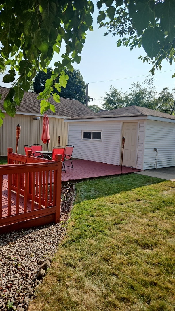 view of yard with a wooden deck