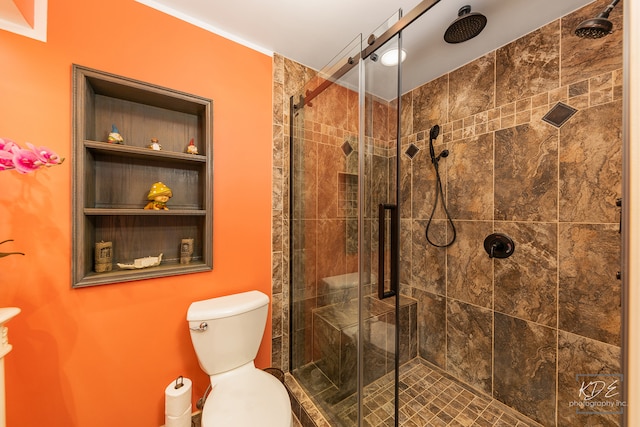 bathroom featuring walk in shower and toilet