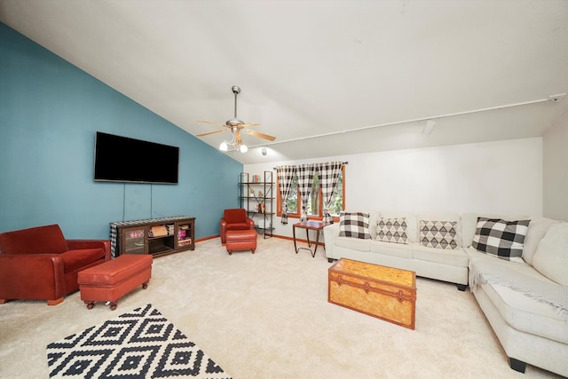 living room with ceiling fan, carpet floors, and lofted ceiling