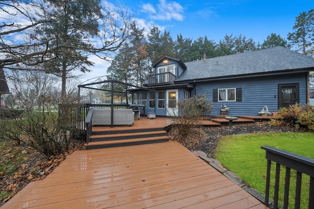 back of property featuring outdoor lounge area, a balcony, and a wooden deck